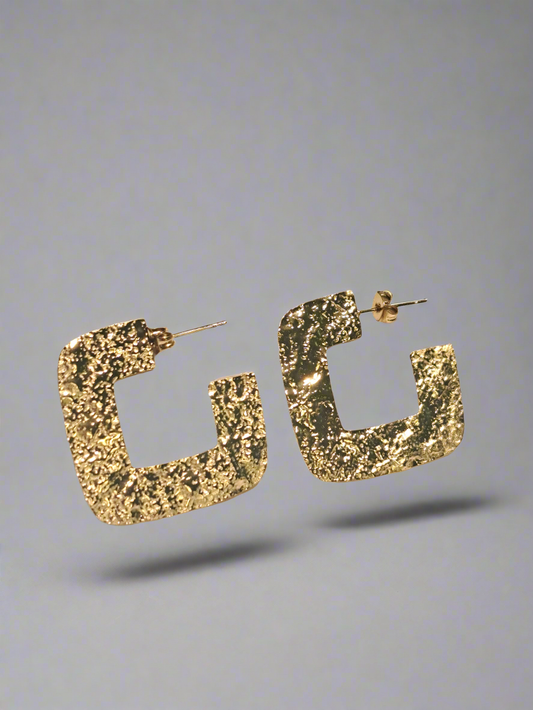 Boucle d'oreille martelée